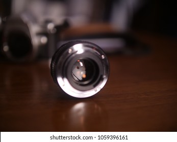 A Promaster 50 Mm Lens With The Aperture Closed, The Pinhole Of The Stopped Down Lens Can Be Seen In Shallow Focus, Only Letting In A Little Bit Of Light 
