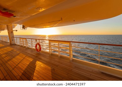 The promenade deck of a cruise ship at sunset. - Powered by Shutterstock