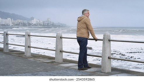 Promenade, sea and thinking with mature man outdoor for calm, peace or view of ocean and waves. Idea, retirement and planning with senior person on boardwalk for quiet, vision or wellness in morning - Powered by Shutterstock