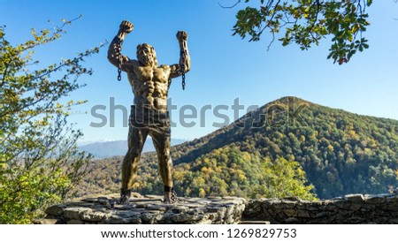 Prometheus sculpture on the backgroung of Ahun mountain, Sochi, Russia
