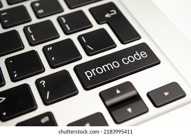 Promo Code text button on keyboard, concept background