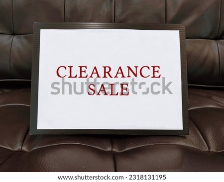 Promotion tag on sofa with text CLEARANCE SALE, to inform customers a sale of goods at big discount prices to get rid of superfluous stock before store closing down