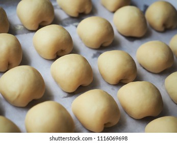 Proofing Mini Bread Rolls On Baking Paper