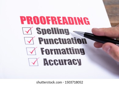 Proofreading Checklist Concept. Man Crossing Checkboxes At Desk