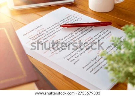 proofreading paper with errors and red correction words for proofreading service concept