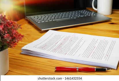 proofreading paper on table in office for service