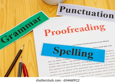 proofreading paper on table with office supplies