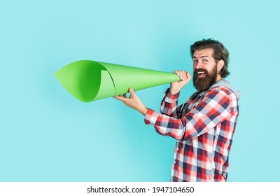 Propaganda or Truth. free man shouting into megaphone. Handsome man shouting through speaker. loud announcement. dont be silent. vote. urge the public. Do not be afraid to express your opinion