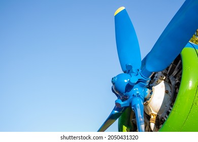 The Propeller Of The Aircraft Close-up. Propeller Blades. The Engine Of The Old Flying Machine. Blue Sky