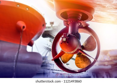 Propeller during to repair already of big Cargo ship Stern and forward ship concept of  Bow thruster freshly fitted in a boat hull at floating dock in shipyard Thailand
