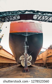 Propeller And Keel Of A Large Cargo Ship In Dry Dock Under Repair