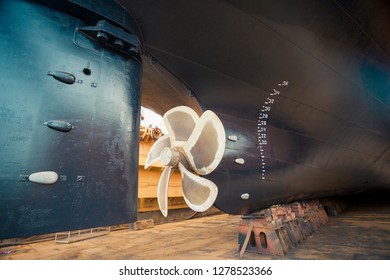 Propeller And Keel Of A Large Cargo Ship In Dry Dock Under Repair