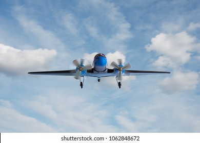 Propeller Plane In Front Of Blue Sky