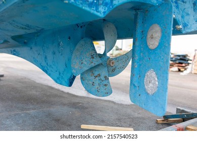 Propeller and rudder of a ship stranded in a shipyard