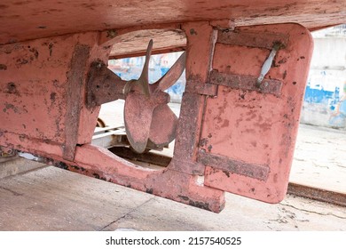Propeller and rudder of a ship stranded in a shipyard