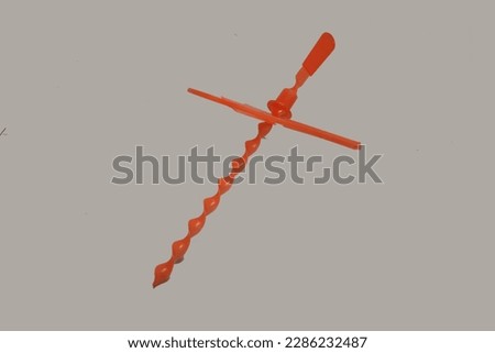 propeller toy made of orange pastik