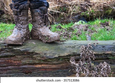 Proper Childhood. Child In Dirty Stained Boots