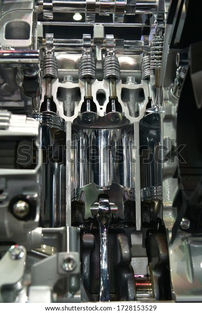 The proper installation of a spark-plug in a car\
piston and connecting rod power stroke  car engine cross section\
show details.