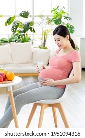 Proper Nutrition Concept - Asian Pregnant Woman Drink A Glass Of Milk