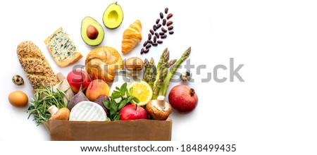 Proper nutrition.Healthy food paper bag.healthy food background. supermarket food concept.home delivery.Food delivery.Grocery.A package with products for the holiday.Christmas and New Year grocery bag