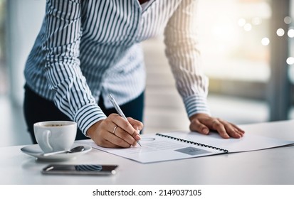 Proper Planning Is Vital For Any Business. Closeup Shot Of An Unrecognizable Businesswoman Writing Notes On A Document In An Office.