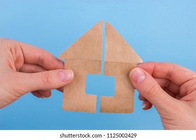 Property Division Concept. Scissors Cut Paper House