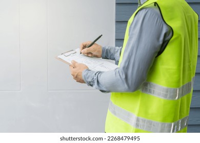 property inspection consultancy. Construction Inspector checking house defect for client. - Shutterstock ID 2268479495