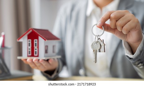Property investment concept. Real estate broker with home insurance policy about house contract - Shutterstock ID 2171718923