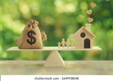 Property investment and house mortgage concept: Wooden home, Family member and US dollar hessian bags on wooden balance scale. depicts family financial management for a residence. - Shutterstock ID 1649938048