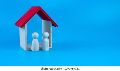 Property Investment, House Mortgage Financial Planning And Real Estate Home Refinancing Concept. Selective Focus On A Toy House And A Couple Wooden Doll