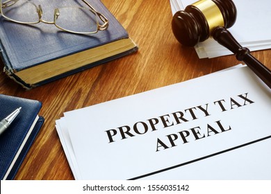 Property Tax Appeal documents and wooden gavel.