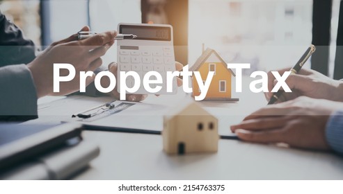 PROPERTY TAX: Sales Manager Or Real Estate Agent Show Calculator For Total Price For Buying A New House To Customer.