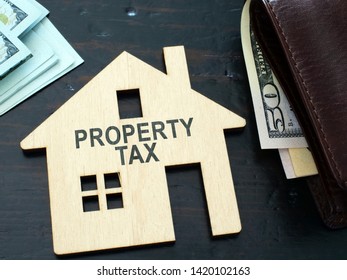 Property Tax Sign On A House Model.