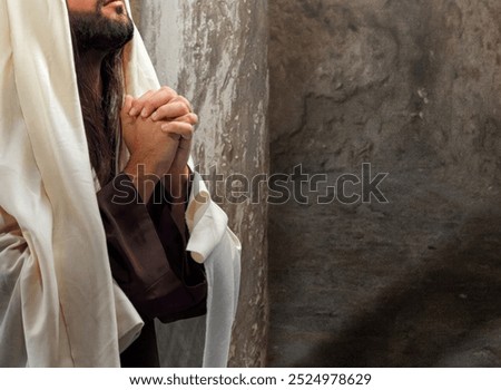 Prophet praying deeply in an ancient building, eyes closed, seeking spiritual connection with god, embodying faith, hope, and reverence