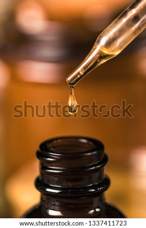 Propolis drop falling.