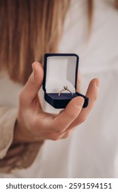 Proposal ring in a box in your hand