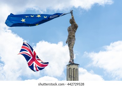 Proposed Referendum On United Kingdom Membership Of The European Union, Antique Stone Statue Holds A European Flag In Hand Including The British Flag.