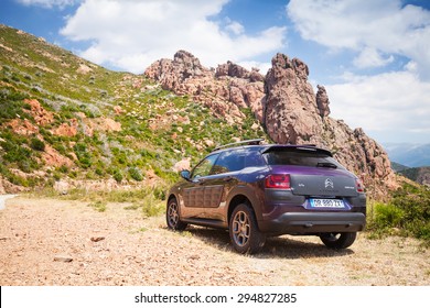 Propriano, France - July 1, 2015: Dark Purple Citroen C4 Cactus Stands On The Rocky Roadside, Corsica, France