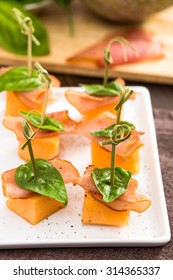 Prosciutto And Cantaloupe Skewers On Plate