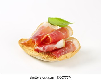 Prosciutto Ham Open Faced Sandwich On White Background