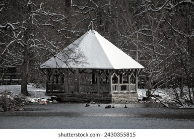 prospect park lake gazebo with snow on the roof during a winter day in brooklyn new york city (ice, frost, frozen water, pond) - Powered by Shutterstock