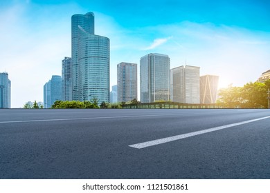 Prospects for expressway, asphalt pavement, city building commer - Shutterstock ID 1121501861