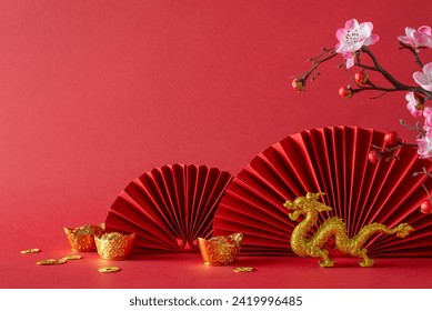 Prosperous composition: Side view of a table adorned with feng shui essentials, gold coins, dragon, sakura blossoms, and fans. A red background offers ample space for text or advertising