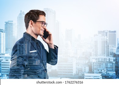 Prosperous handsome entrepreneur in suit and glasses pensively talking phone and looking on Bangkok cityscape. The concept of problem solving consulting. Downtown view. Double exposure. - Powered by Shutterstock