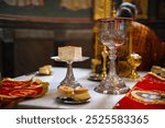 Prosphora, prosvir, liturgical church bread, which is used during the Orthodox communion, silver bowls, an icon, on the throne of the Orthodox Church. The concept of Orthodoxy.