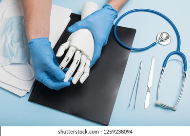 Prosthetics Hands At Doctor In Clinic. Artificial Limb.