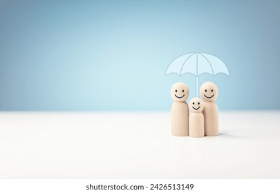 Protect and care for your family, umbrella above a family cover and shelter wooden people, security, protection, finance or insurance concept - Powered by Shutterstock