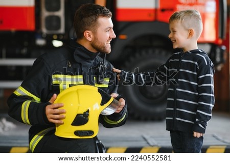 Protect people from dangerous with brave heart.Hero in fireman with uniform safe children from burn smoke.