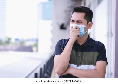 Protect self from virus. Asian man wearing face mask to protect himself from any virus or pollution.  - Powered by Shutterstock