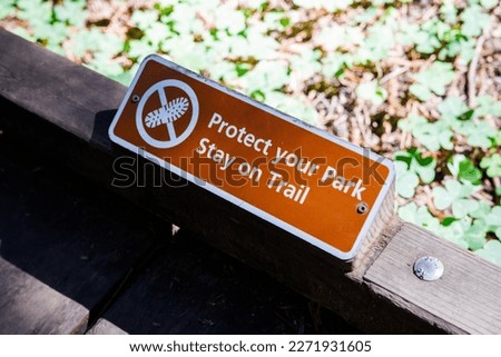 Protect your park, Stay on trail sign board in Muir woods forest path